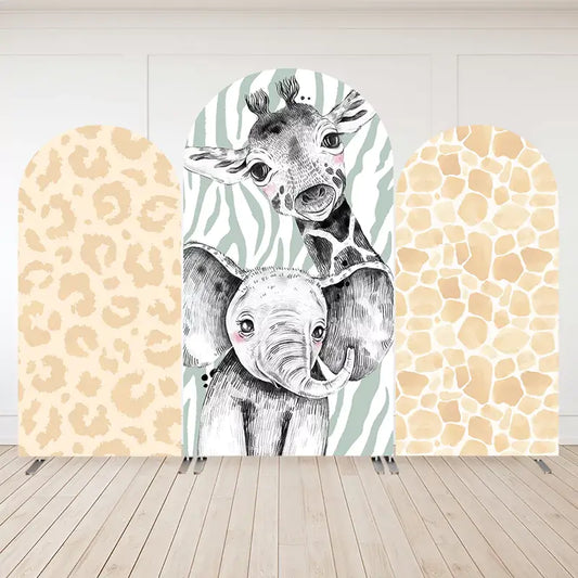 Arch panel safari arch backdrop set with hand-drawn black-and-white giraffe and elephant illustration in the center, flanked by leopard and giraffe print panels.
