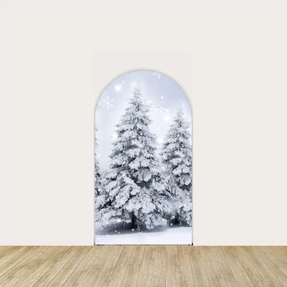 Left arch panel with frosted evergreen trees and falling snowflakes on a pale blue winter sky.