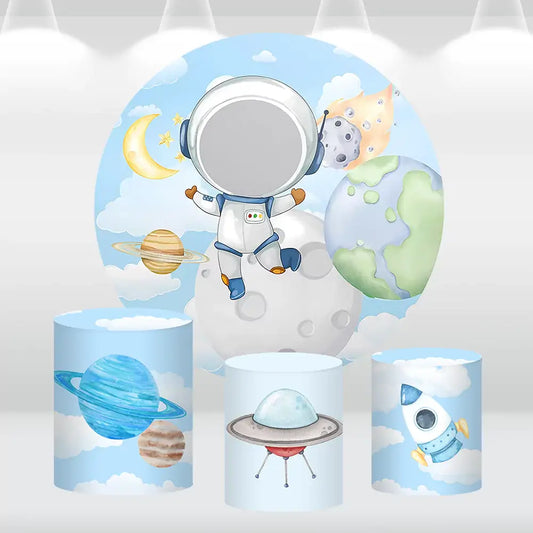 Space-themed round astronaut backdrop with matching cylinder covers featuring planets, a rocket, and a UFO, perfect for kids’ birthday parties.