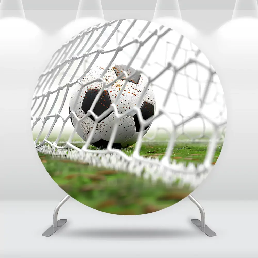 Round backdrop featuring a soccer ball hitting the goal net on a green grass field, perfect for sports-themed parties and soccer events.