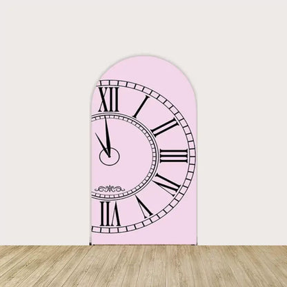 Pink arched backdrop with a vintage-style clock face showing Roman numerals, adding a whimsical Wonderland touch to event decor.