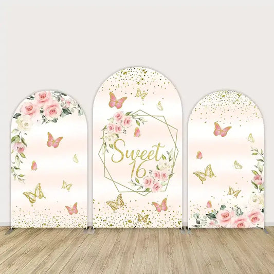 Three-panel Sweet 16 arch backdrop with blush pink background, gold glitter, butterflies, and roses—elegant and feminine birthday party decor.