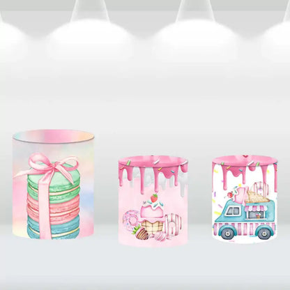 Three dessert-themed backdrop cylinder covers featuring macarons, donuts, and ice cream truck designs
