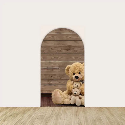 Left arch panel featuring a family of plush teddy bears sitting in front of a rustic wooden background—perfect for a cozy baby shower scene.