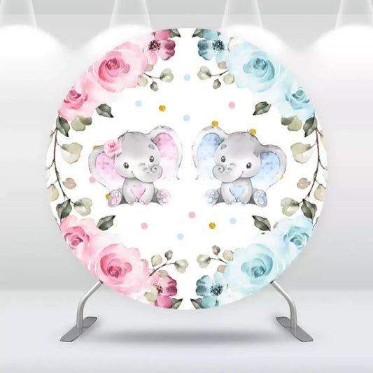 Round baby shower backdrop with two cute baby elephants, one with pink accents and one with blue, surrounded by floral borders in pink and blue tones on a white background with polka dots.