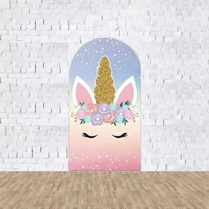 Center arch panel with a unicorn face, closed eyes, gold glitter horn, and pastel floral crown—set against a pink-to-blue starry gradient background.
