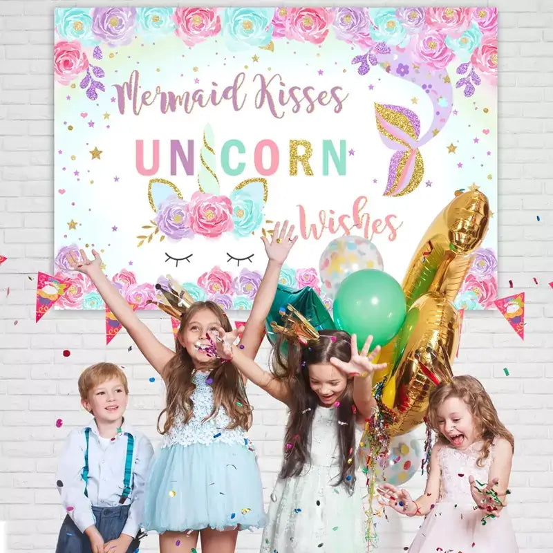 Unicorn and mermaid-themed party backdrop with pastel rainbow colors, floral decorations, and glitter accents, ideal for children's parties.