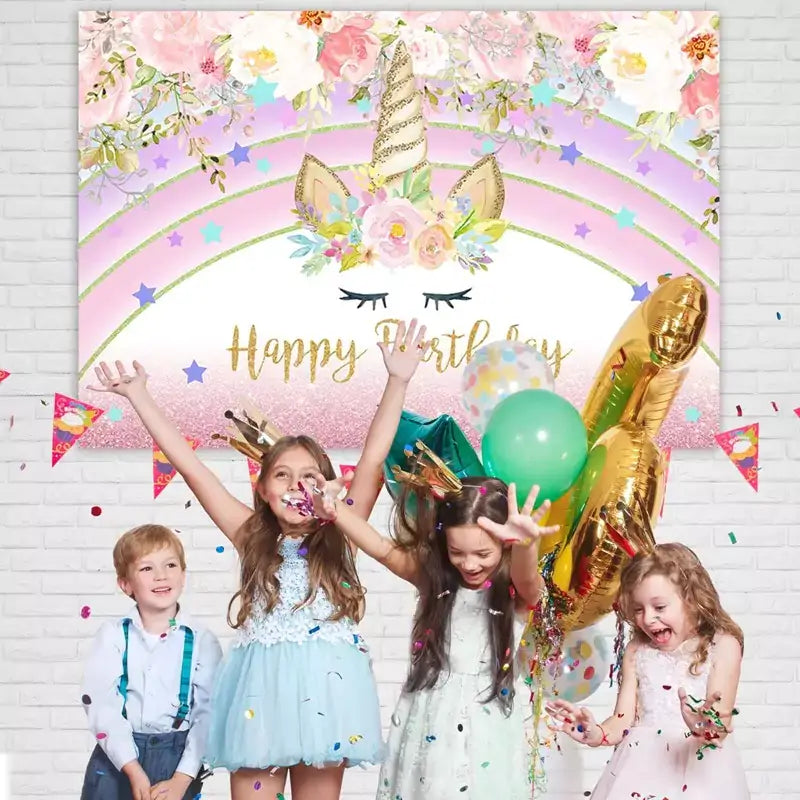 Girly unicorn party banner featuring a glittery golden horn, closed eyes, pastel rainbow, and floral decorations – ideal for whimsical birthday celebrations.