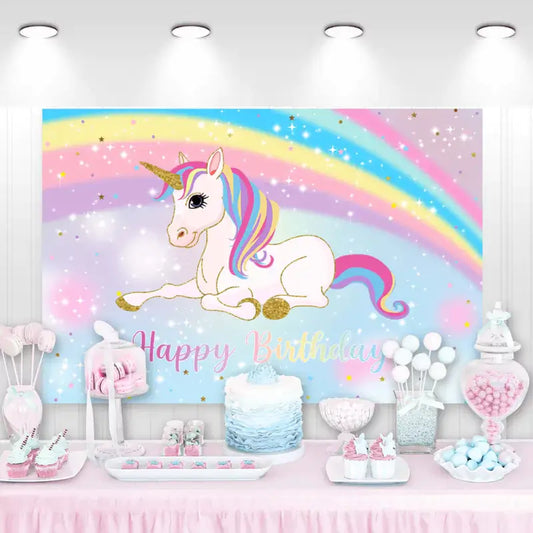 Colorful unicorn birthday backdrop featuring a playful unicorn, a vibrant rainbow, and sparkling stars for a children's party.