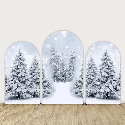 Winter wonderland backdrop with snow-covered trees and forest scene, ideal for Christmas or winter-themed events