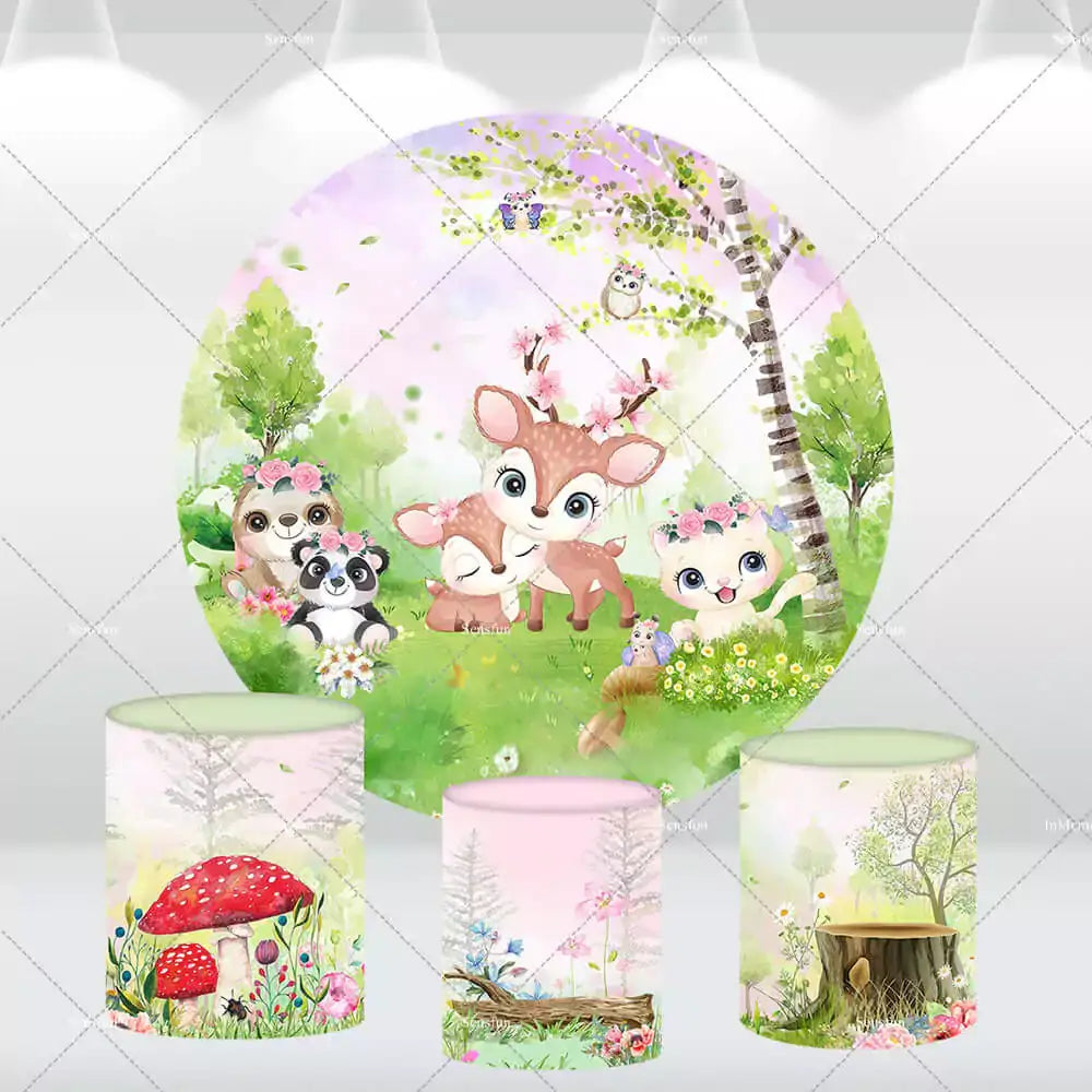 Woodland animal-themed round backdrop with three cylinder covers for baby shower or birthday party decor.