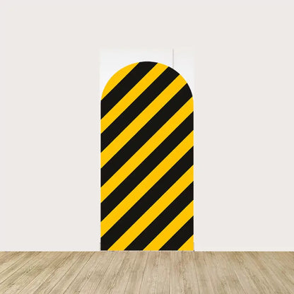 Arch panel with bold yellow and black diagonal caution stripes—great for builder-themed birthday parties or construction event decor.
