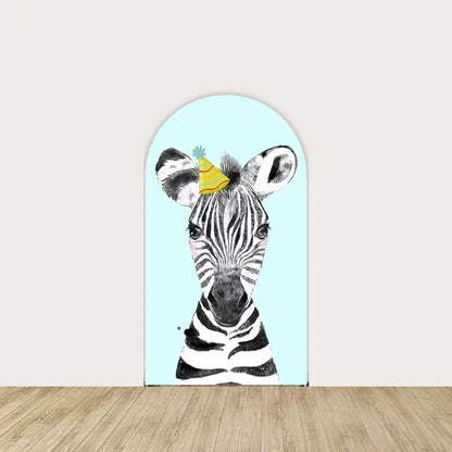 Light blue backdrop featuring a zebra wearing a yellow party hat, adding a fun and playful safari theme to the birthday decor.